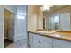 Bathroom featuring a single sink with cabinets, tile flooring, and a shower/tub combo at 4751 Travini Circle # 4-116, Sarasota, FL 34235