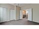 Spacious bedroom with double closets and views to the upper level at 4751 Travini Circle # 4-116, Sarasota, FL 34235