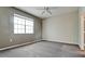 Spacious bedroom features a ceiling fan, neutral paint, and a large window for ample natural light at 4751 Travini Circle # 4-116, Sarasota, FL 34235