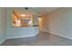 Inviting living space featuring an open layout to the kitchen with tile floors and neutral paint at 4751 Travini Circle # 4-116, Sarasota, FL 34235
