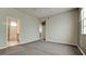 Large main bedroom with ceiling fan, view to bath and access to staircase at 4751 Travini Circle # 4-116, Sarasota, FL 34235