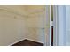 Spacious walk-in closet with shelving provides ample storage space for clothing and personal items at 4751 Travini Circle # 4-116, Sarasota, FL 34235