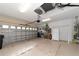 Spacious two-car garage with ample storage space and a utility refrigerator at 7418 Monte Verde, Sarasota, FL 34238