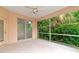 Screened in patio with tile floors and views of greenery at 7418 Monte Verde, Sarasota, FL 34238