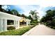 Las Palmas Luxury Condominiums entrance with lush landscaping at 4751 Travini Circle # 4-116, Sarasota, FL 34235