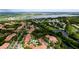 Wide aerial view showcasing the community and golf course at 4751 Travini Circle # 4-116, Sarasota, FL 34235