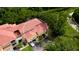 Aerial view of condo building, showcasing the property's location and surrounding landscape at 4751 Travini Circle # 4-116, Sarasota, FL 34235