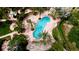Inviting community pool with surrounding lounge chairs and lush landscaping at 4751 Travini Circle # 4-116, Sarasota, FL 34235