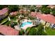 Aerial view of community, highlighting pool and building aesthetics at 4751 Travini Circle # 4-116, Sarasota, FL 34235