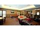 Community clubhouse with comfortable seating and a pool table at 4751 Travini Circle # 4-116, Sarasota, FL 34235