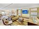 Spacious lobby with comfortable seating areas and a large TV at 915 Seaside Dr # 606 Weeks 12-13, Sarasota, FL 34242