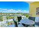 Relaxing balcony with outdoor furniture and scenic community views at 915 Seaside Dr # 606 Weeks 12-13, Sarasota, FL 34242