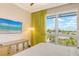 Comfortable bedroom with large windows and TV at 915 Seaside Dr # 606 Weeks 12-13, Sarasota, FL 34242