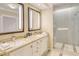 Double vanity, granite countertops, and a large glass shower at 915 Seaside Dr # 607 Weeks 14-15, Sarasota, FL 34242