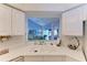 Kitchen with double sink and view of living room at 5519 Fair Oaks St # 2-D, Bradenton, FL 34203