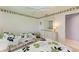 Cozy bedroom with twin beds and dresser at 5519 Fair Oaks St # 2-D, Bradenton, FL 34203