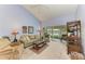 Bright living room with lake view and comfy seating at 5519 Fair Oaks St # 2-D, Bradenton, FL 34203