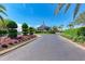 Community clubhouse entrance with landscaping and circular driveway at 5519 Fair Oaks St # 2-D, Bradenton, FL 34203