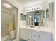 Clean bathroom with double vanity and shower/tub combo at 5519 Fair Oaks St # 2-D, Bradenton, FL 34203