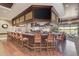 Clubhouse bar with granite counter, stools, and large screen TV at 5519 Fair Oaks St # 2-D, Bradenton, FL 34203