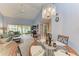 Bright dining area with chandelier and glass table at 5519 Fair Oaks St # 2-D, Bradenton, FL 34203