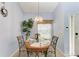 Cozy dining area with round table and four chairs at 5519 Fair Oaks St # 2-D, Bradenton, FL 34203