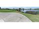 Landscaped golf course with pond and homes in the background at 5519 Fair Oaks St # 2-D, Bradenton, FL 34203