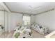 Bright bedroom with twin beds and window seat at 5519 Fair Oaks St # 2-D, Bradenton, FL 34203