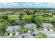Aerial view of community with golf course and lake at 5519 Fair Oaks St # 2-D, Bradenton, FL 34203