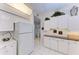 White kitchen with ample counter and cabinet space at 5519 Fair Oaks St # 2-D, Bradenton, FL 34203