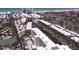 Aerial shot of waterfront condos and waterways offering boat docks and tennis courts at 1300 N Portofino Dr # 208, Sarasota, FL 34242