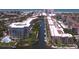 Aerial view of a coastal condo community with boat access and waterfront views at 1300 N Portofino Dr # 208, Sarasota, FL 34242