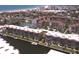 Aerial shot of waterfront condos, tennis courts, and boat docks near the Gulf at 1300 N Portofino Dr # 208, Sarasota, FL 34242