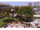 Community common area with picnic tables, benches, and mature tropical landscaping at 1300 N Portofino Dr # 208, Sarasota, FL 34242