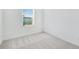 Bright bedroom with a window and neutral carpet at 3051 Novara Ln, Lakewood Ranch, FL 34211