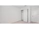 Bright bedroom with neutral carpet, closet, and white trim at 3055 Novara Ln, Lakewood Ranch, FL 34211