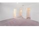 Spacious bedroom with neutral carpet, walk in closet, and ensuite bathroom provides a serene retreat at 3055 Novara Ln, Lakewood Ranch, FL 34211