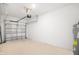 Spacious, clean garage with white walls and floor, ready for parking at 3055 Novara Ln, Lakewood Ranch, FL 34211