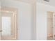 Bright hallway shows bedroom and bath doorway entrances at 3055 Novara Ln, Lakewood Ranch, FL 34211