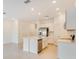 Open-concept kitchen with a large island and stainless steel appliances, ideal for entertaining at 3055 Novara Ln, Lakewood Ranch, FL 34211