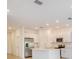 Spacious kitchen featuring stainless steel appliances, white cabinetry, and large island at 3055 Novara Ln, Lakewood Ranch, FL 34211
