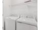 Clean laundry room featuring modern washer and dryer at 3055 Novara Ln, Lakewood Ranch, FL 34211