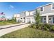 Two-story townhome with gray siding and landscaping at 3149 Novara Ln, Lakewood Ranch, FL 34211