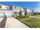 Two-story townhome with gray siding and landscaping at 3149 Novara Ln, Lakewood Ranch, FL 34211