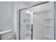 Clean bathroom with a shower and glass enclosure at 3153 Novara Ln, Lakewood Ranch, FL 34211