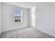 Bright bedroom with window and grey carpet at 3153 Novara Ln, Lakewood Ranch, FL 34211