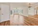 Bright living room with hardwood floors and sliding glass doors at 1300 N Portofino Dr # 208, Sarasota, FL 34242