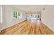 Living room featuring hardwood floors and large windows at 1300 N Portofino Dr # 208, Sarasota, FL 34242