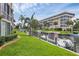 Waterfront property with lush landscaping and boat slips at 1300 N Portofino Dr # 208, Sarasota, FL 34242
