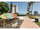 Siesta Key Village entrance with palm trees and walkway at 1300 N Portofino Dr # 208, Sarasota, FL 34242
